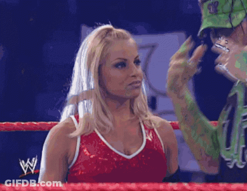 Man And Woman In Wrestling Ring With Letter W GIF