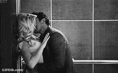 Man And Woman Kissing GIF