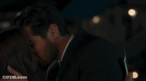 Man And Woman Kissing GIF