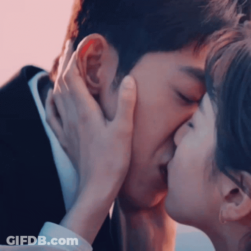 Man And Woman Kissing GIF