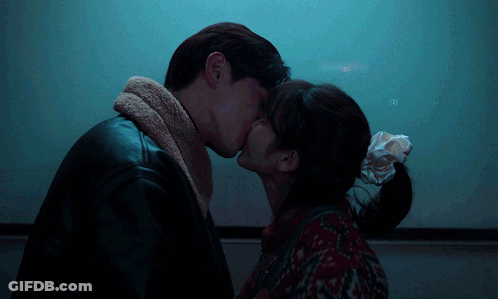Man And Woman Kissing GIF