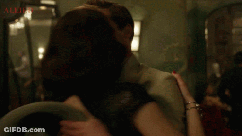 Man And Woman Kissing Allied GIF