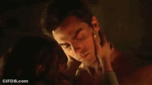 Man And Woman Kissing And Hugging GIF