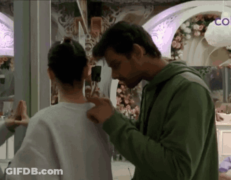 Man And Woman Kissing At Restaurant Table GIF