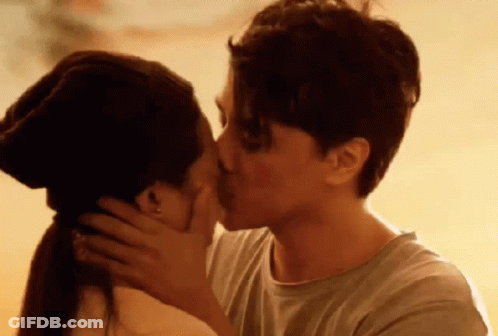Man And Woman Kissing At Sunset GIF