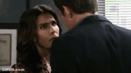 Man And Woman Kissing By Window GIF
