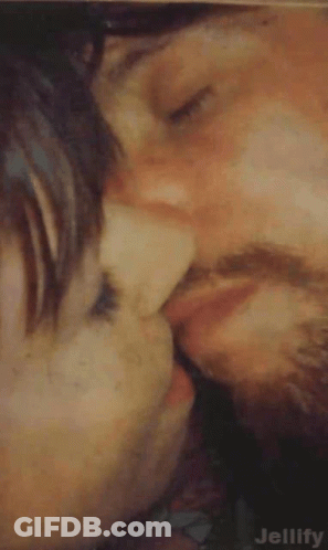 Man And Woman Kissing Cheek GIF