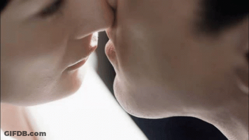Man And Woman Kissing Close Up GIF