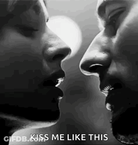 Man And Woman Kissing GIF