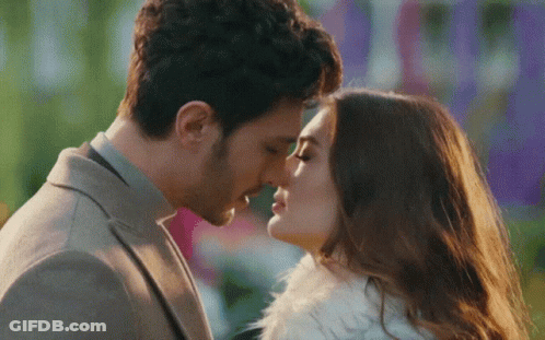 Man And Woman Kissing GIF