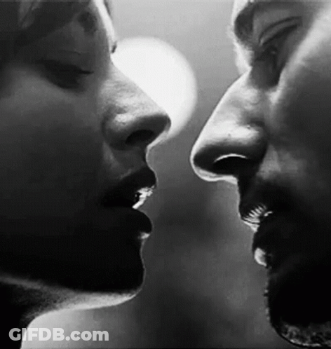 Man And Woman Kissing GIF