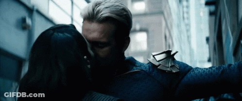 Man And Woman Kissing In Alleyway GIF