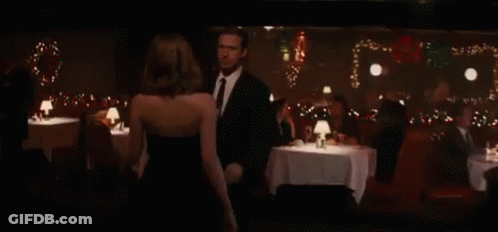 Man And Woman Kissing In Bar GIF