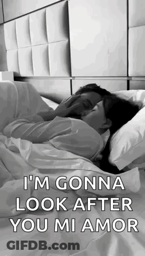 Man And Woman Kissing In Bed GIF