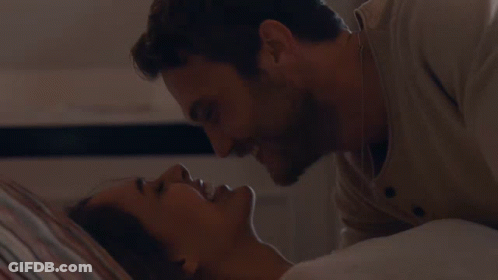 Man And Woman Kissing In Bed Touching Face GIF