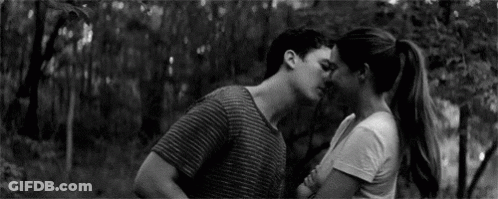Man And Woman Kissing In Black And White GIF
