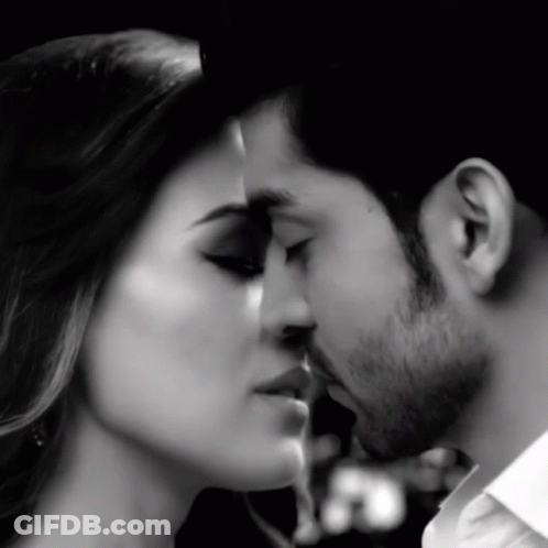 Man And Woman Kissing In Black And White Photo GIF