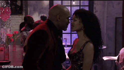 Man And Woman Kissing In Crowd GIF