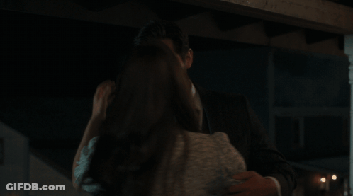 Man And Woman Kissing In Dark GIF