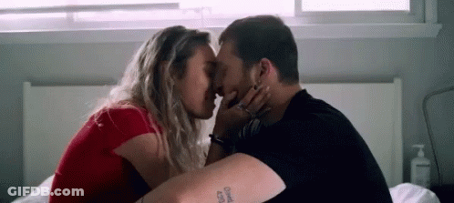 Man And Woman Kissing In Dark Room GIF