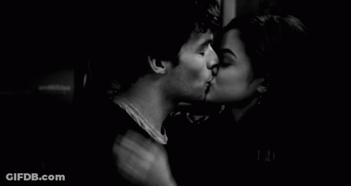 Man And Woman Kissing In Dark Room GIF