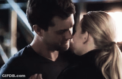Man And Woman Kissing In Dark Room GIF