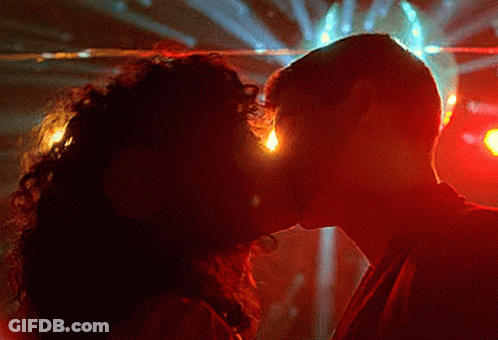 Man And Woman Kissing In Dark Room GIF