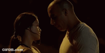 Man And Woman Kissing In Dark Room GIF