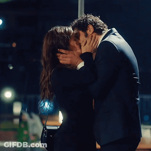 Man And Woman Kissing In Dark Room GIF