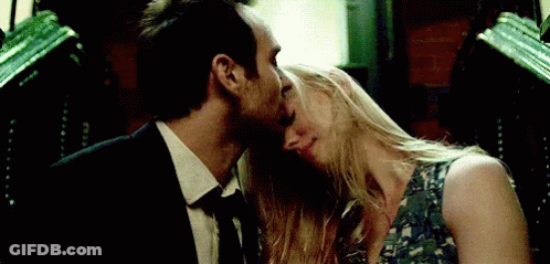 Man And Woman Kissing In Dark Room GIF