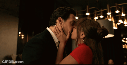 Man And Woman Kissing In Dark Room GIF