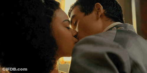 Man And Woman Kissing In Dark Room GIF