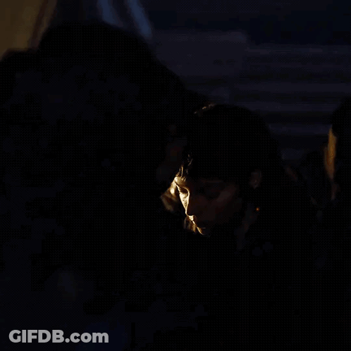 Man And Woman Kissing In Dark Room GIF
