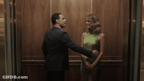 Man And Woman Kissing In Elevator GIF