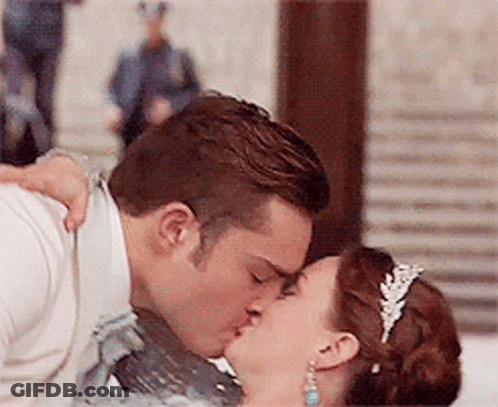 Man And Woman Kissing In Front Of Crowd GIF