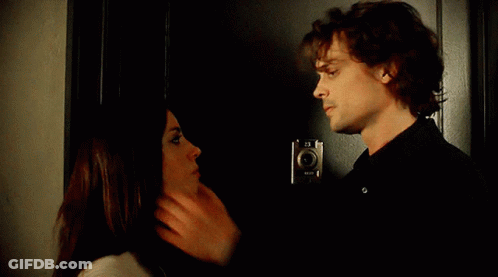 Man And Woman Kissing In Front Of Door GIF