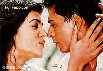 Man And Woman Kissing In Front Of Kulfyapp.com GIF