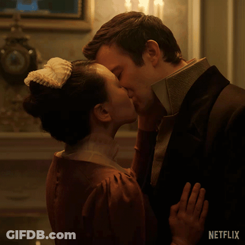 Man And Woman Kissing In Front Of Netflix Logo GIF