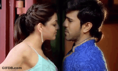 Man And Woman Kissing In Front Of Red Door GIF