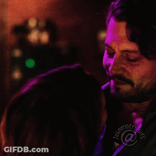 Man And Woman Kissing In Front Of Tommydcpp GIF