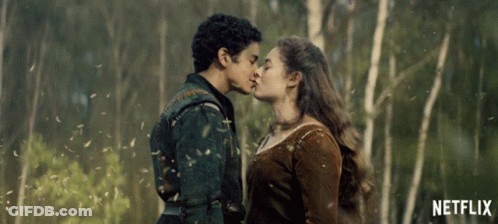 Man And Woman Kissing In Front Of Trees With Netflix GIF