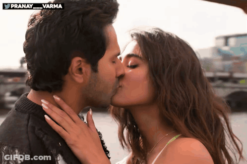 Man And Woman Kissing In Front Of Twitter Logo Pranay Varma GIF