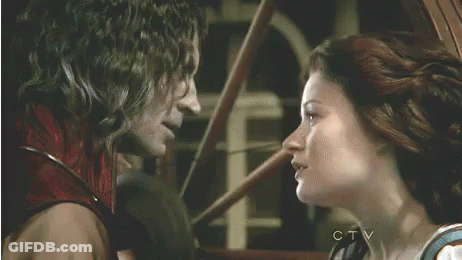 Man And Woman Kissing In Front Of Window GIF