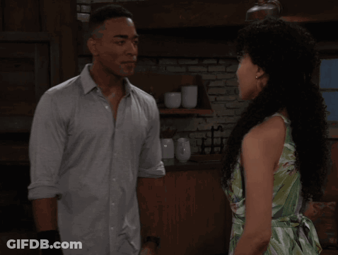 Man And Woman Kissing In Kitchen GIF