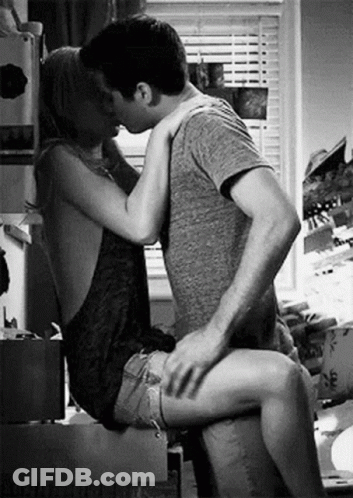 Man And Woman Kissing In Kitchen GIF