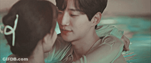 Man And Woman Kissing In Pool GIF