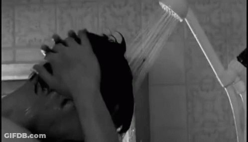 Man And Woman Kissing In Rain GIF