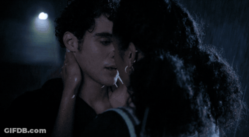 Man And Woman Kissing In Rain At Night GIF