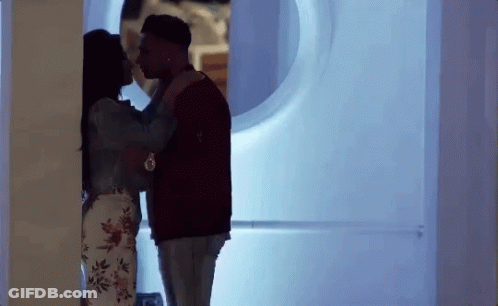 Man And Woman Kissing In Room GIF