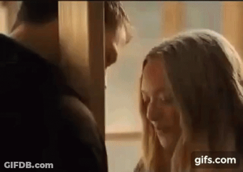 Man And Woman Kissing In Room GIF